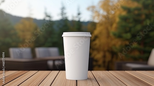 White paper coffee cup on the wooden table in the room, mockup