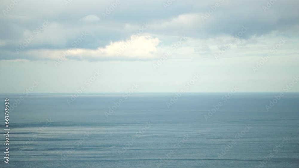 Aerial view on calm azure sea and volcanic rocky shores. Small waves on water surface in motion blur. Nature summer ocean sea beach background. Nobody. Holiday, vacation and travel concept Aerial view on calm azure sea and volcanic rocky shores. Small waves on water surface in motion blur. Nature summer ocean sea beach background. Nobody. Holiday, vacation and travel concept