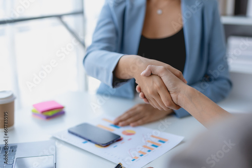 Business success. Business people handshake agreement confirmed in the investment business. Successful business people meeting together.