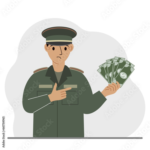 Military man holds a lot of money in his hand. The concept of payment for military service or service in the army under a contract.