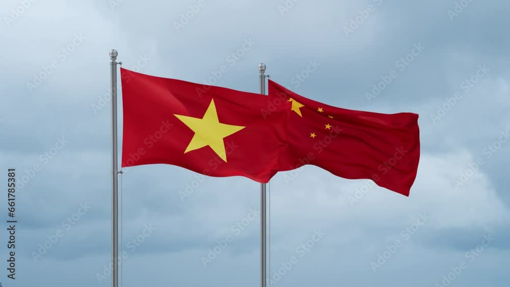China flag and Vietnam flag waving together on cloudy sky, endless seamless loop, two country relations concept China flag and Vietnam flag waving together on cloudy sky, endless seamless loop, two country relations concept