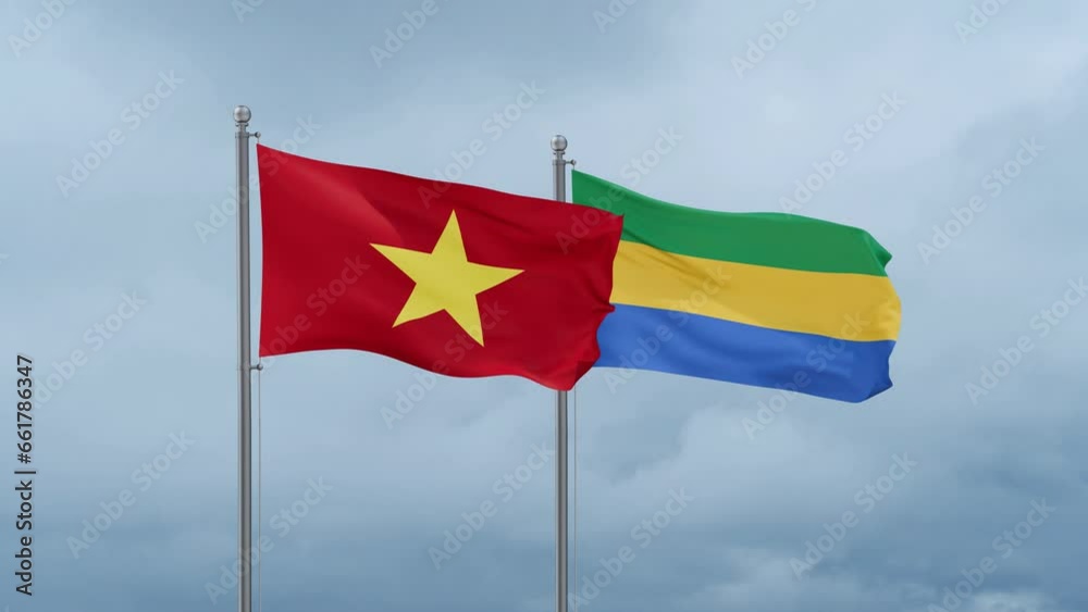 Gabon flag and Vietnam flag waving together on cloudy sky, endless seamless loop, two country relations concept Gabon flag and Vietnam flag waving together on cloudy sky, endless seamless loop, two country relations concept