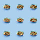 Delicious French Ratatouille food seamless photo pattern on a solid color background