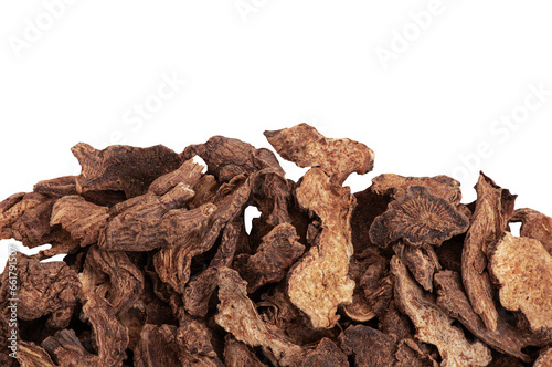 Dried Atractylodes lancea slices on transparent background.