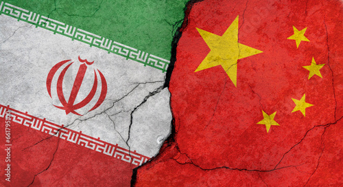 Flags of Iran and China, texture of concrete wall with cracks, grunge background, concept of military conflict