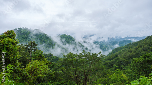 Doi Luang Chiang Dao mountain hills in Chiang Mai, Thailand. Nature landscape in travel trips and vacations. Doi Lhung Chiang Dao Viewpoint with clouds mist and fog during rain season © Fokke Baarssen