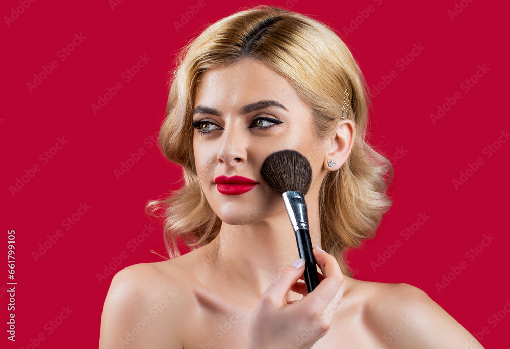 Make up in process. Beautiful young woman applying makeup. Applying tone to skin. Girl holding makeup brushes and make up on face with cosmetics. Facial beauty. Perfect skin, natural make up Make up in process. Beautiful young woman applying makeup. Applying tone to skin. Girl holding makeup brushes and make up on face with cosmetics. Facial beauty. Perfect skin, natural make up