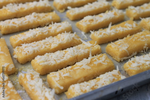 Rows of Indonesian cakes called kastangel on a table ready to bake photo