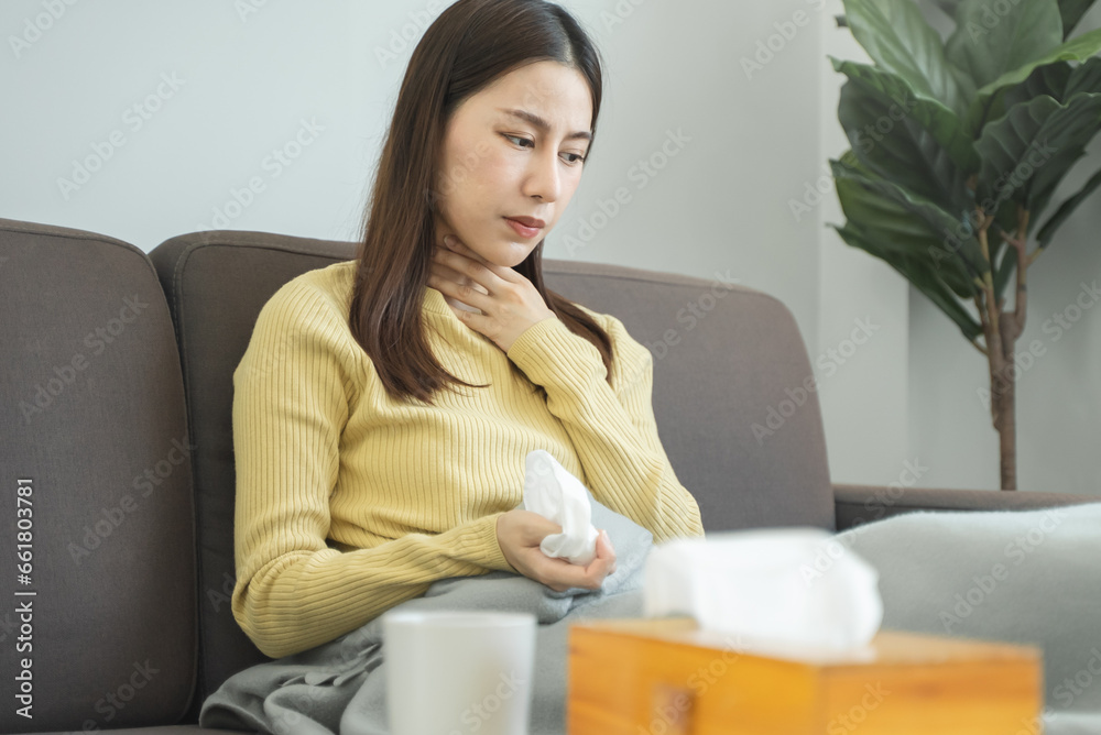 woman touch her neck and feeling a sore throat woman touch her neck and feeling a sore throat