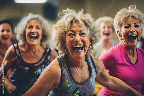 Image of a group of women over 50 years old doing a Zumba class at a sports center Concept of health and wellness. photo