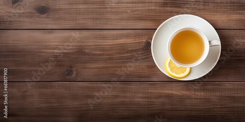 Rustic charm. Hot drink top view. Morning aroma. Fresh lemon tea on vintage wooden breakfast table. Cafe nostalgia. Vintage cup and saucer on surface