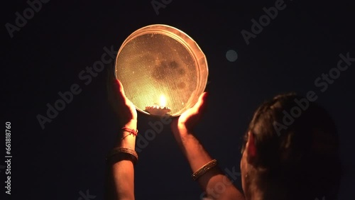 Karwa Chauth strainer and Diya oil lamps for the Karwa Chauth celebration on the night photo