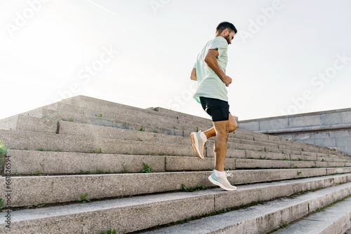 Photography Athlete trainer exercises to warm up muscles