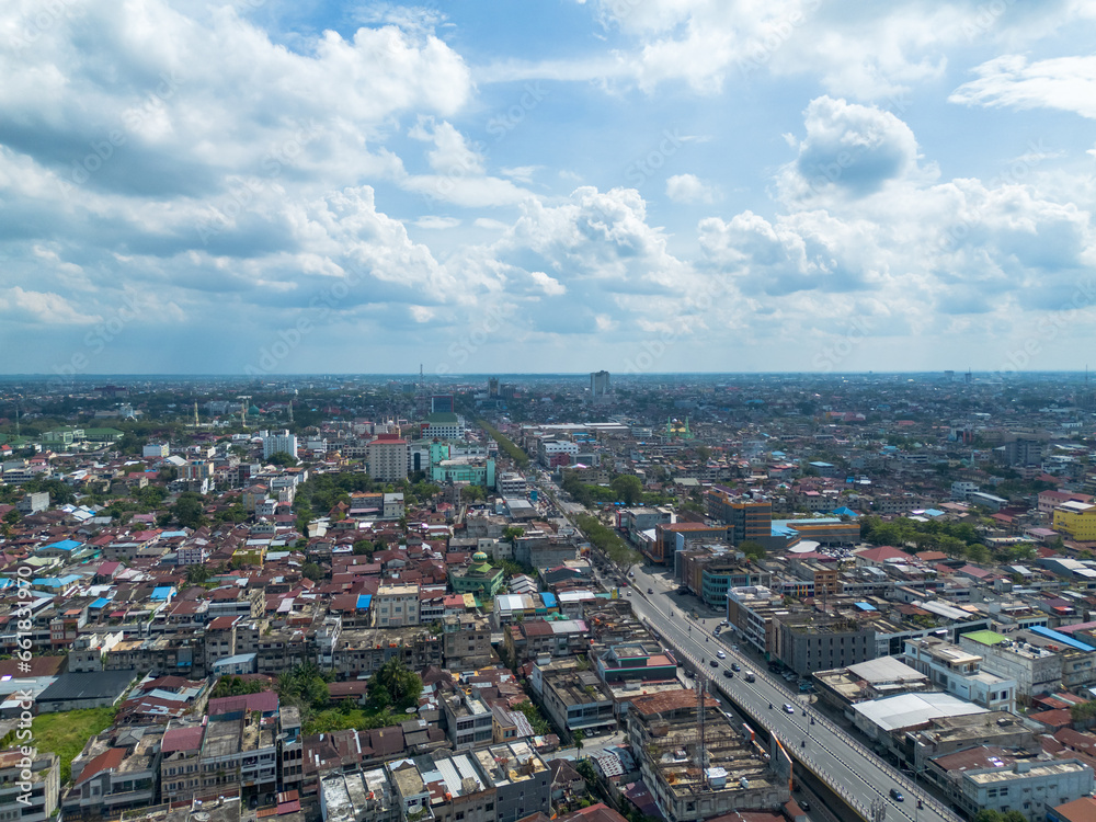Fototapeta premium Aerial View of Pekanbaru city skyline. The capital city of Riau province with many residential buildings.
