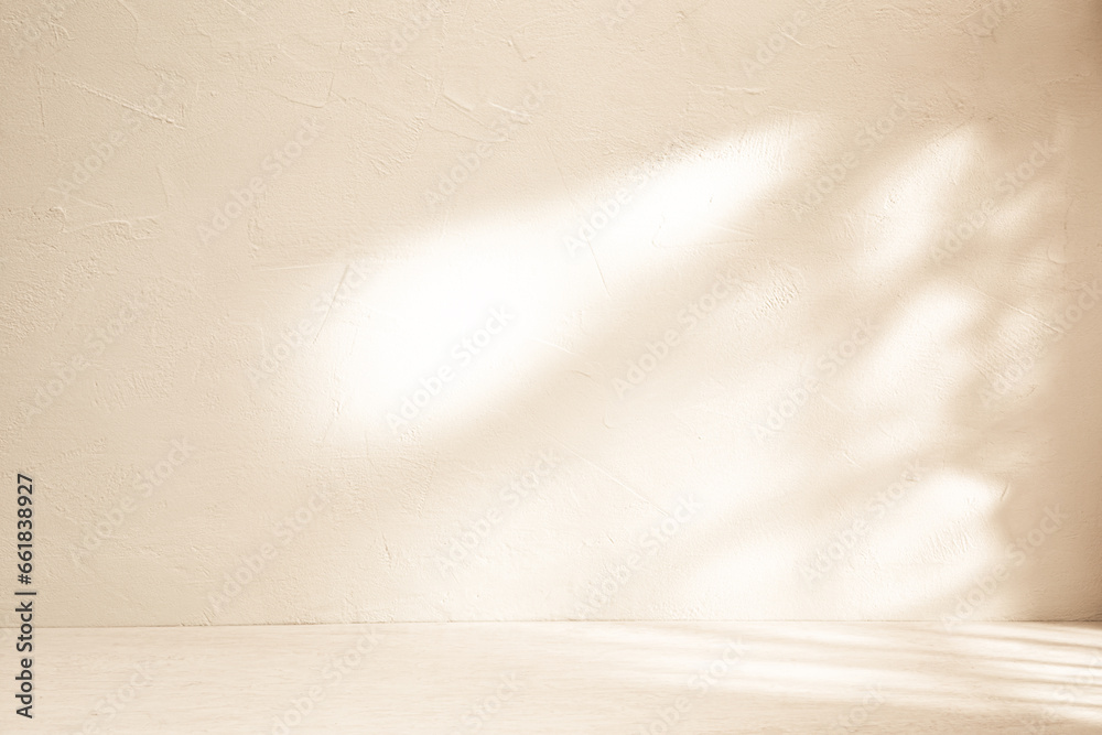 Obraz premium Beige background for product presentation with shadow and light from the window