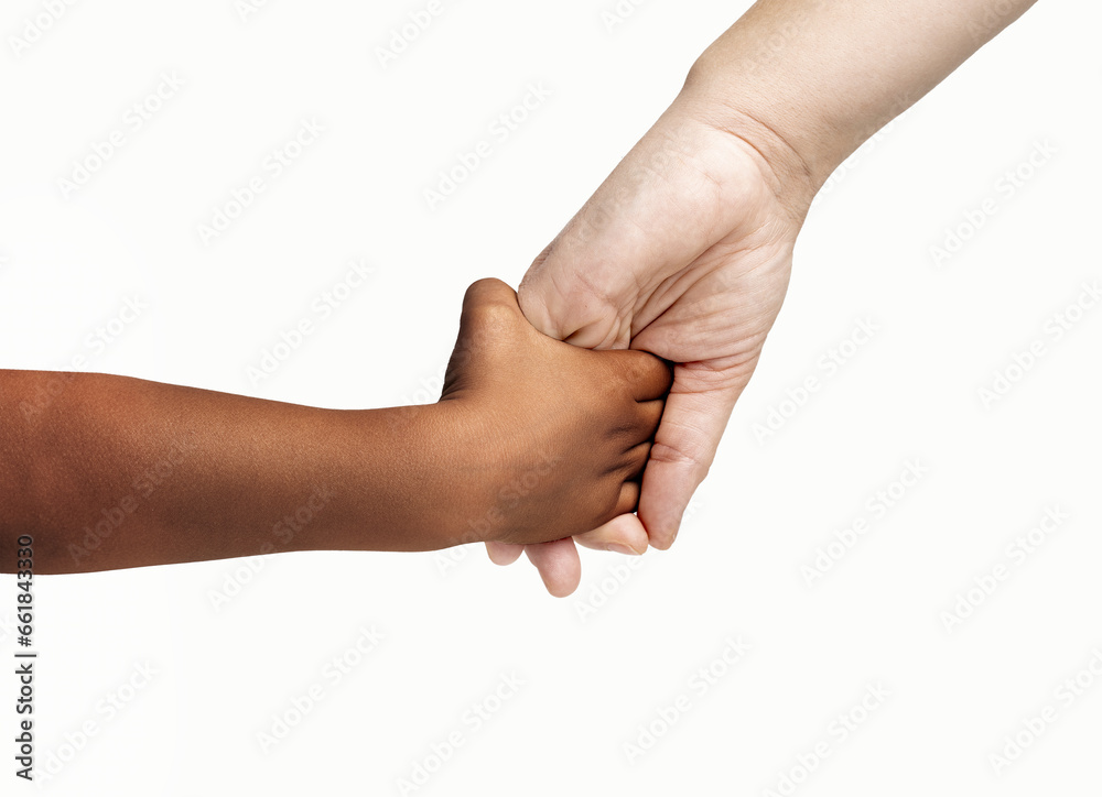 Close up of a caucasian mother giving a hand to an afro child isolated on white background.