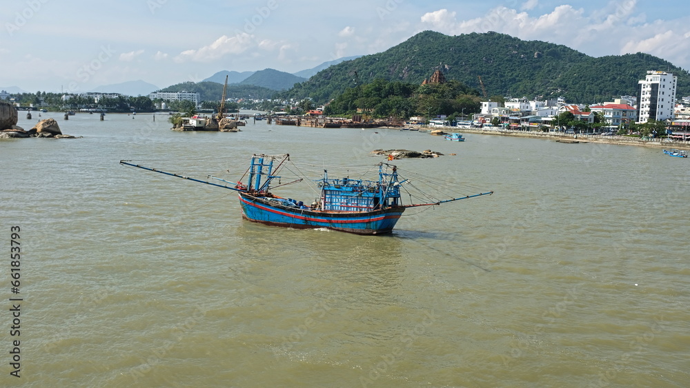 Traditional fishermen's boat (called junk)on a river in Nha Trang, Vietnam, Asia