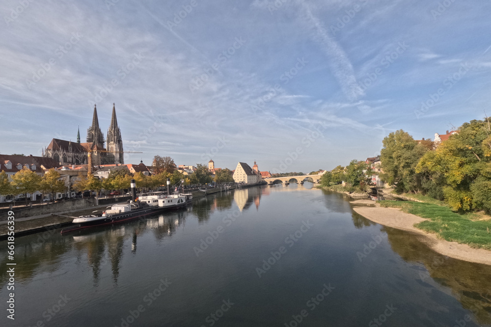 Regensburg on the Danube with stone bridge in sunshine and clouds in autumn