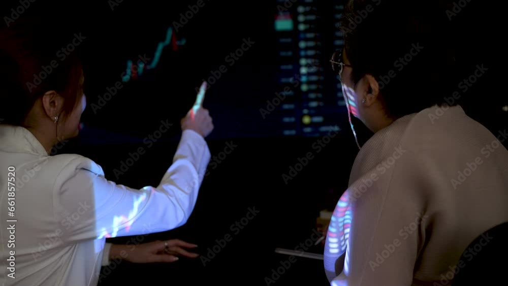 Asian woman investor advice to Asian Senior, Elderly, Retired woman to planning investment in Stock Exchange Market. Asian woman investor advice to Asian Senior, Elderly, Retired woman to planning investment in Stock Exchange Market.