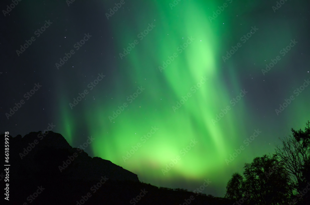 Northern lights on the sky behind the arctic circle in the north Norway during autumn
