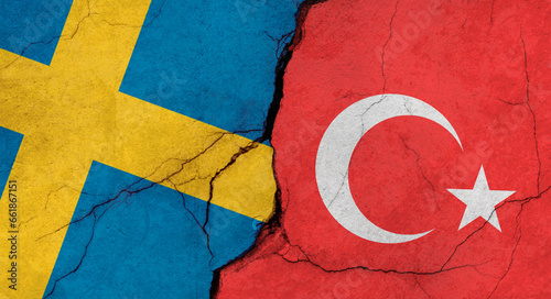 Sweden and Turkey flags, concrete wall texture with cracks, grunge background, military conflict concept