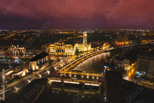 Oradea romania tourism aerial a cityscape illuminated by night lights, showcasing its historic and cultural landmarks