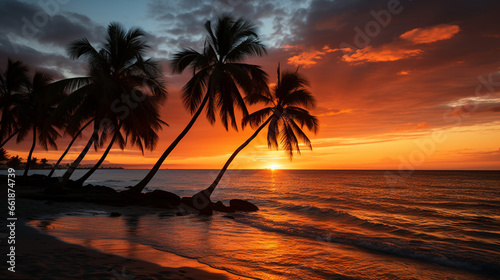 Beach Sunset: Silhouettes of palm trees against a backdrop of a vibrant, orange sunset over the ocean. © Наталья Евтехова