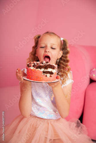little girl eating cake