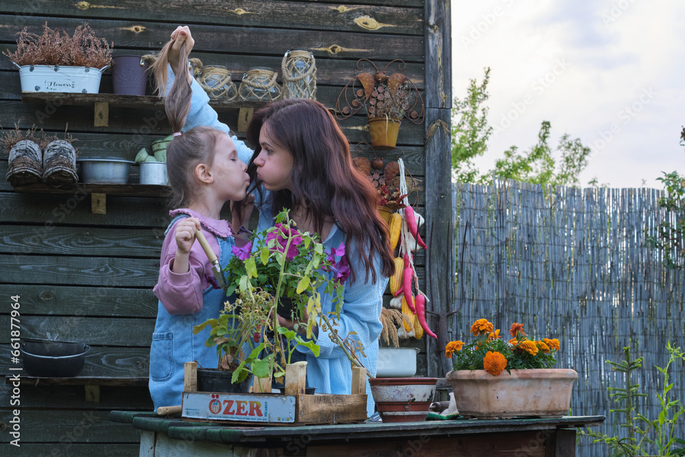 Planting Unity: Mother and daughter, immersed in greenery, foster bonds and knowledge through gardening