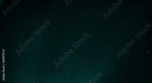 Starry sky with azure nuances of aurora borealis in the sky of Reykjavik, Iceland