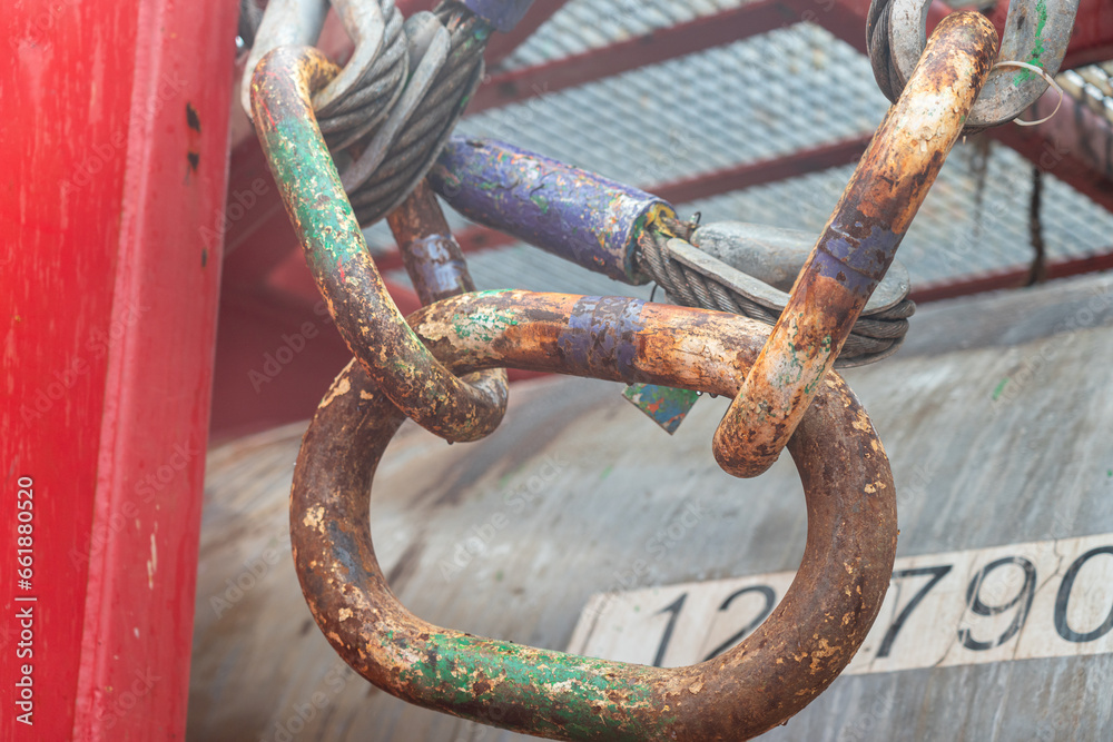 Steel hook and master link, lifting gear for crane operation that using for lifting the heavy object. Industrial operation equipment, selective focus. Steel hook and master link, lifting gear for crane operation that using for lifting the heavy object. Industrial operation equipment, selective focus.