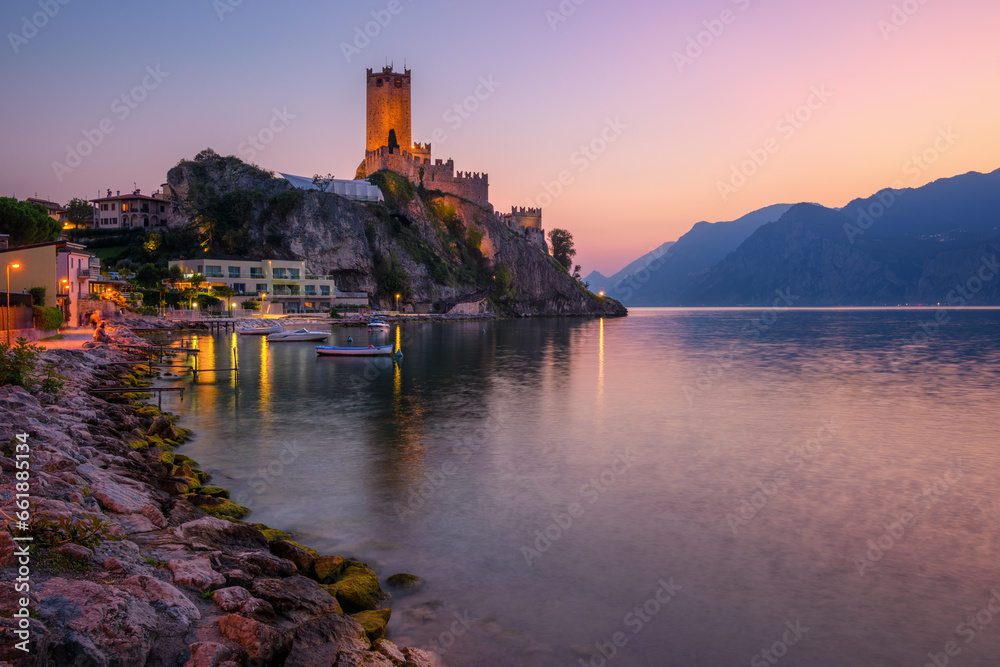 Malcesine town on Lake Garda, Italy, on dramatic sunset - obrazy, fototapety, plakaty 