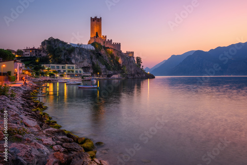 Malcesine town on Lake Garda, Italy, on dramatic sunset