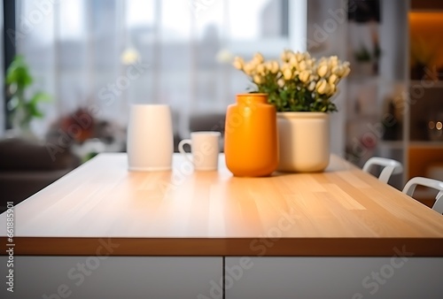 Close up of coffee cups and vase on wooden table in kitchen