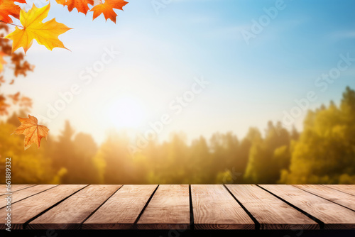 Wooden table with autumn leaves on nature forest background. Mock up for display of product. High quality photo