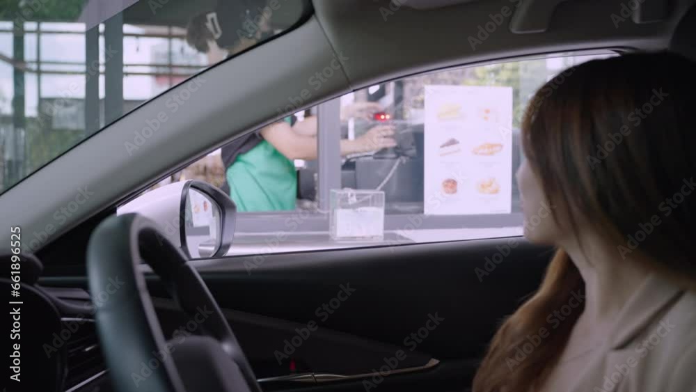 Contactless payment. Pay for food or drinks via smart phone using barcode reader scanning barcode by driving through or drive thru. Contactless payment. Pay for food or drinks via smart phone using barcode reader scanning barcode by driving through or drive thru.