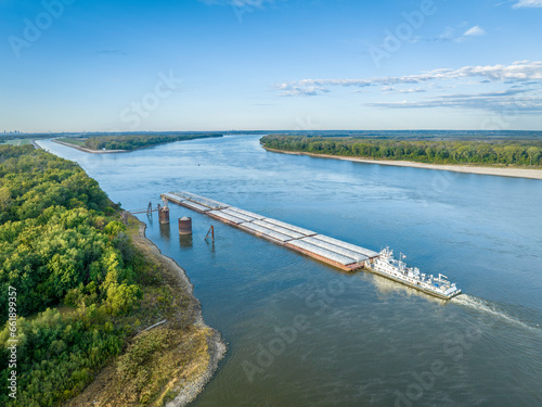 towboat with barges on the Mississippi River is entering Chain of Rocks Bypass Canal above St Louis