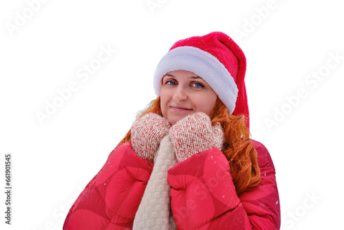 A smiling woman wraps herself in clothes warming up in a winter forest with trees in the snow  isolated on a white background