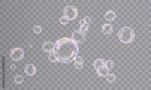 Realistic bubbles isolated on transparent background. Vector illustration of iridescent bubbles with shiny rainbow surface, bubble bath, symbol of freedom and childhood fun.