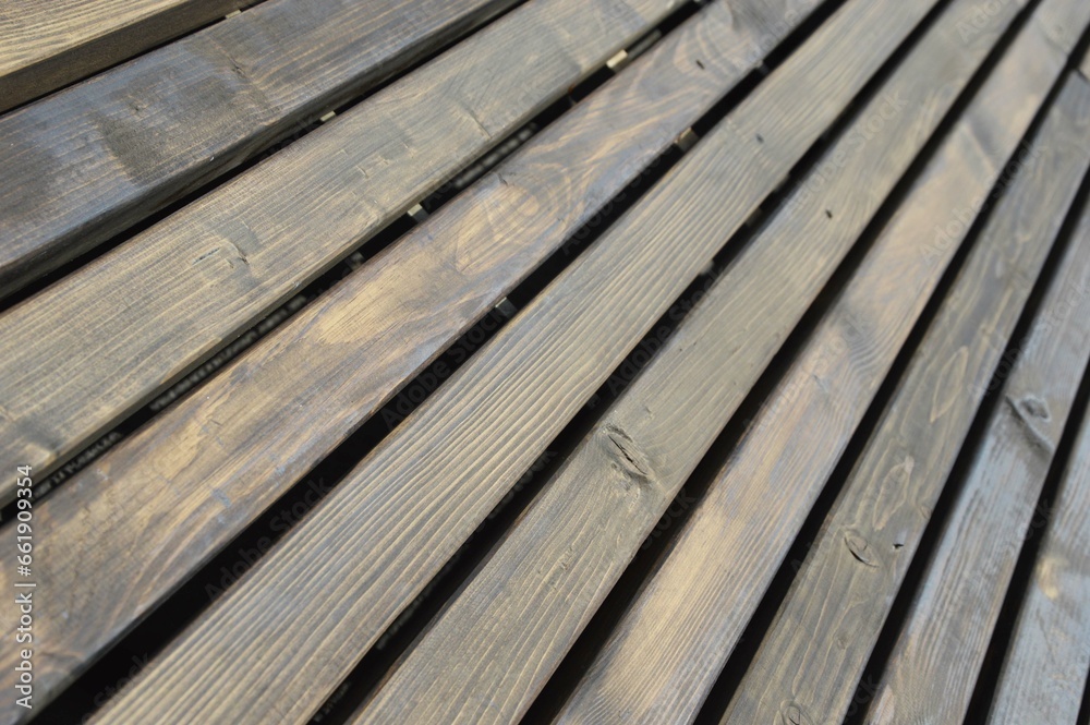 Wooden wall, fence made of brown diagonal boards with texture. Background. Wooden wall, fence made of brown diagonal boards with texture. Background.