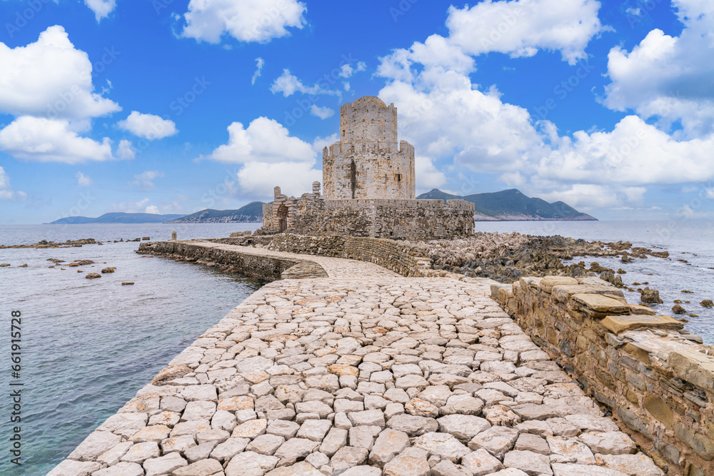 Methoni, Greece - 8 February 2023 - Watch tower of the the Methoni Castle. An old mid sen.Venetian castle dating to the 1200s, on a rocky promontory with an arched bridge & an old prison.