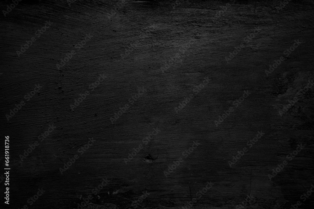 Textured black grunge background. Black concrete texture as a concept of horror and Halloween