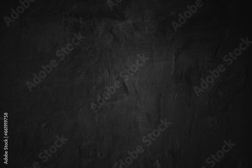 Textured black grunge background. Black concrete texture as a concept of horror and Halloween