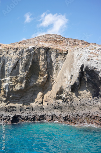 Rocky cliff seen from the water, Galapagos Islands, Ecuador.