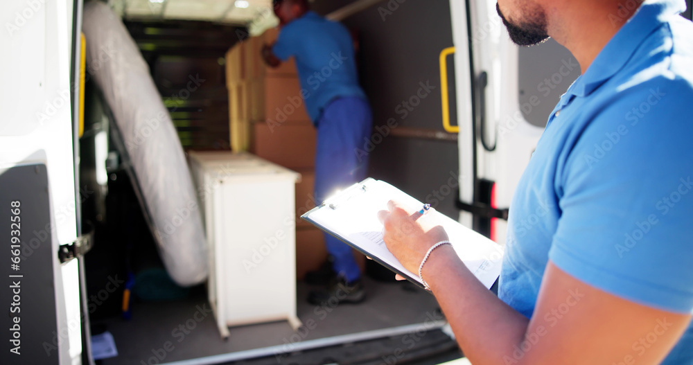 Movers Checking Delivery Boxes Movers Checking Delivery Boxes