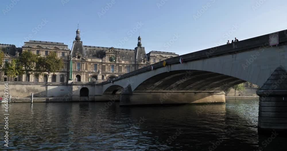 The Pont du Carrousel and the Louvre museum building, bank of the Seine river, Paris, France The Pont du Carrousel and the Louvre museum building, bank of the Seine river, Paris, France