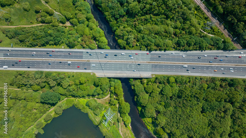 Wallpaper Mural traffic on the highway. Heavy traffic after work on lakeside highway at sunset. Public transport and train passing over train tracks Torontodigital.ca