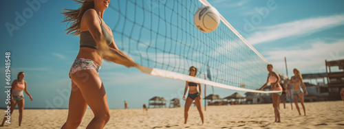 Group of friends playing beach volleyball photo