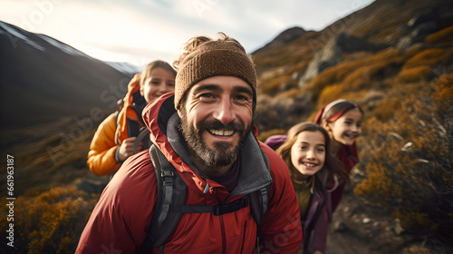 father with his daughters, trekking in the mountains in Bariloche, Argentine Patagonia, traveling through Latin America, family time