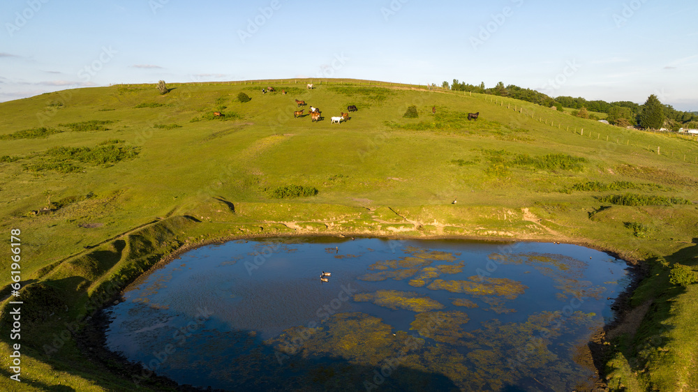 Lake and pond on the plateau. A lake in a green mountain landscape. Lake view taken with a drone. thermal spa
